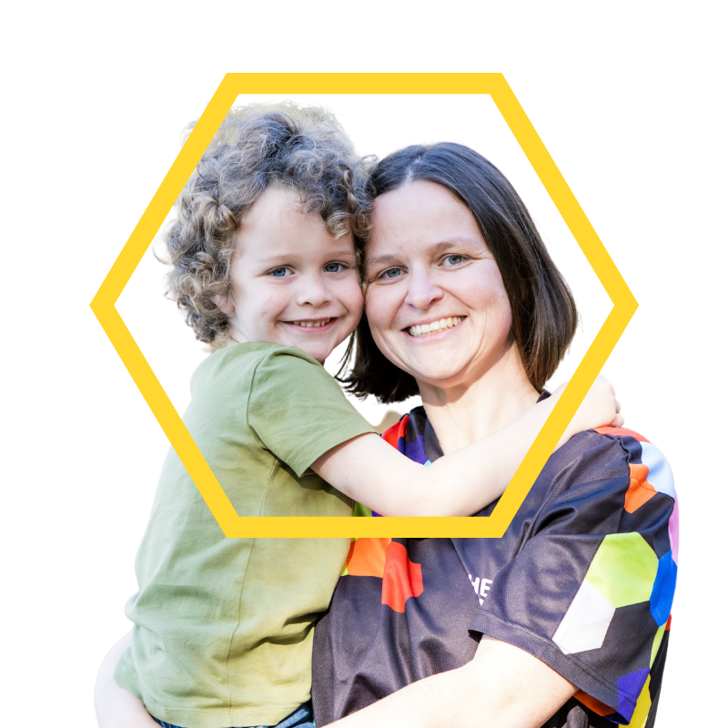 Tanya McAleer and her son Bradley smile for the camera while hugging.